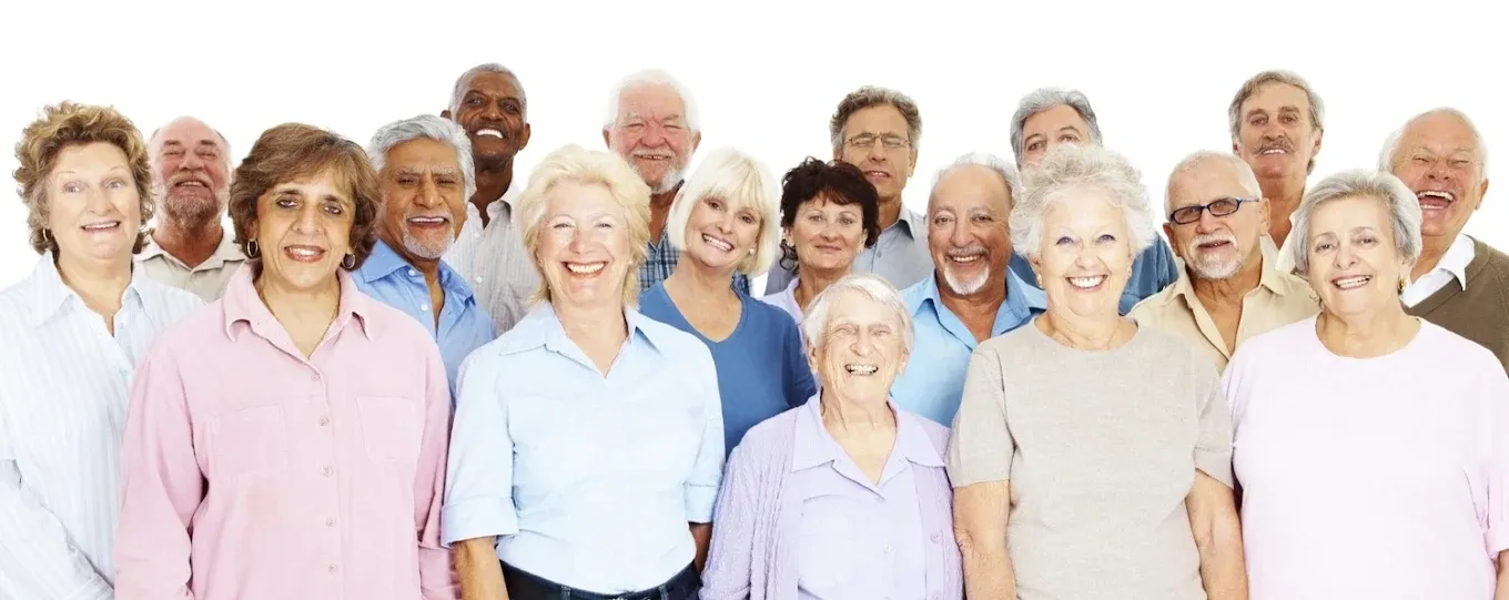 A cheerful group of seniors smiling together.
